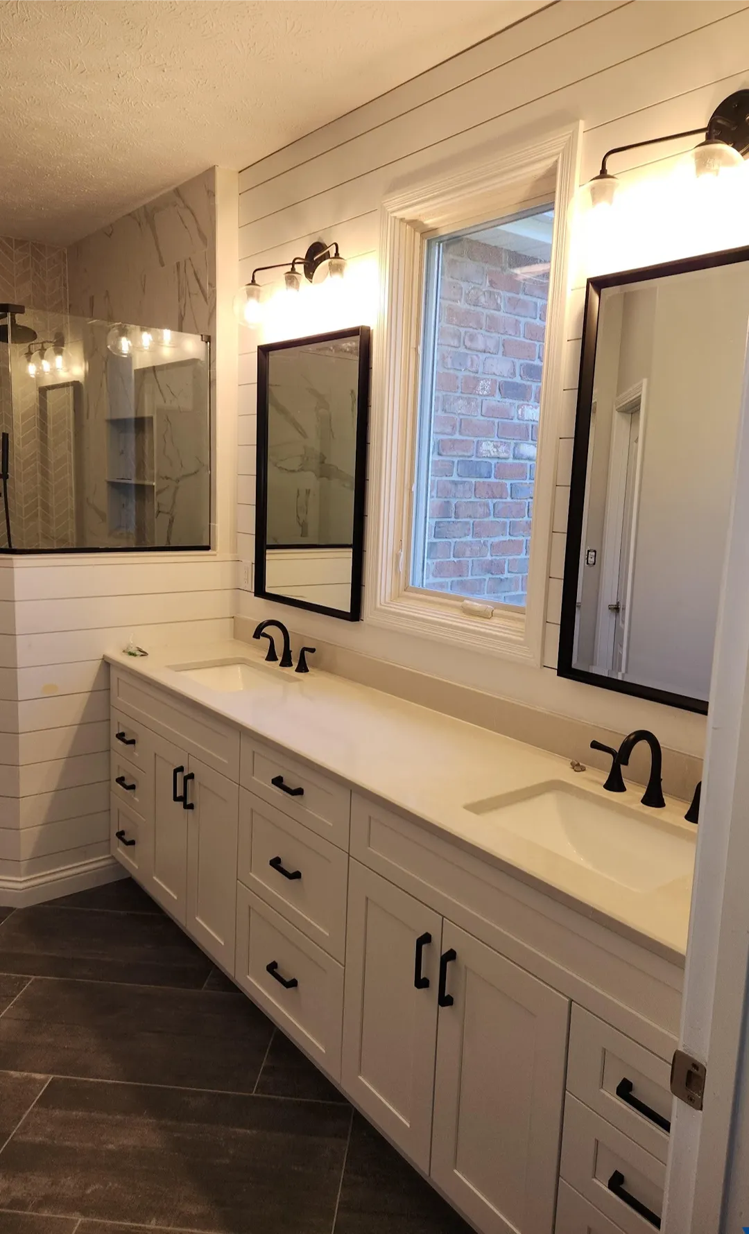 bathroom remodel double vanity shiplap dark tile floor