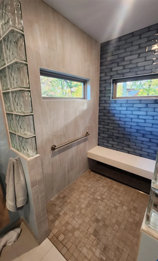 bathroom remodel finished shower with mosaic tile floor