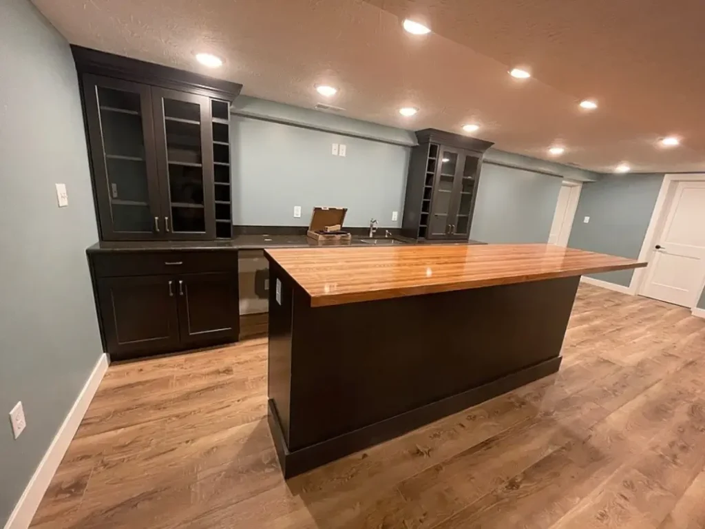 Modern basement bar with large wooden island