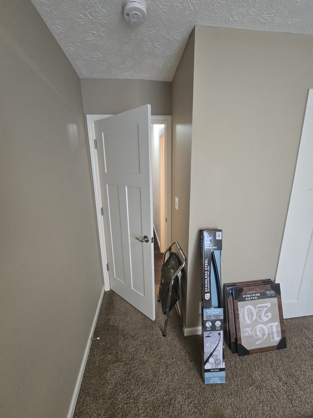 Lafayette bedroom before remodeling, with flat builder grade walls and trim