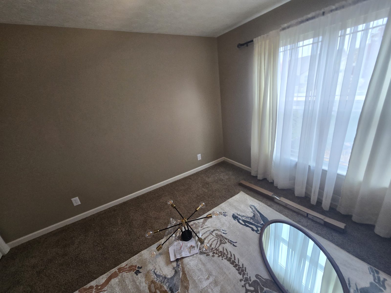 Lafayette bedroom window wall and carpet before the trim work began