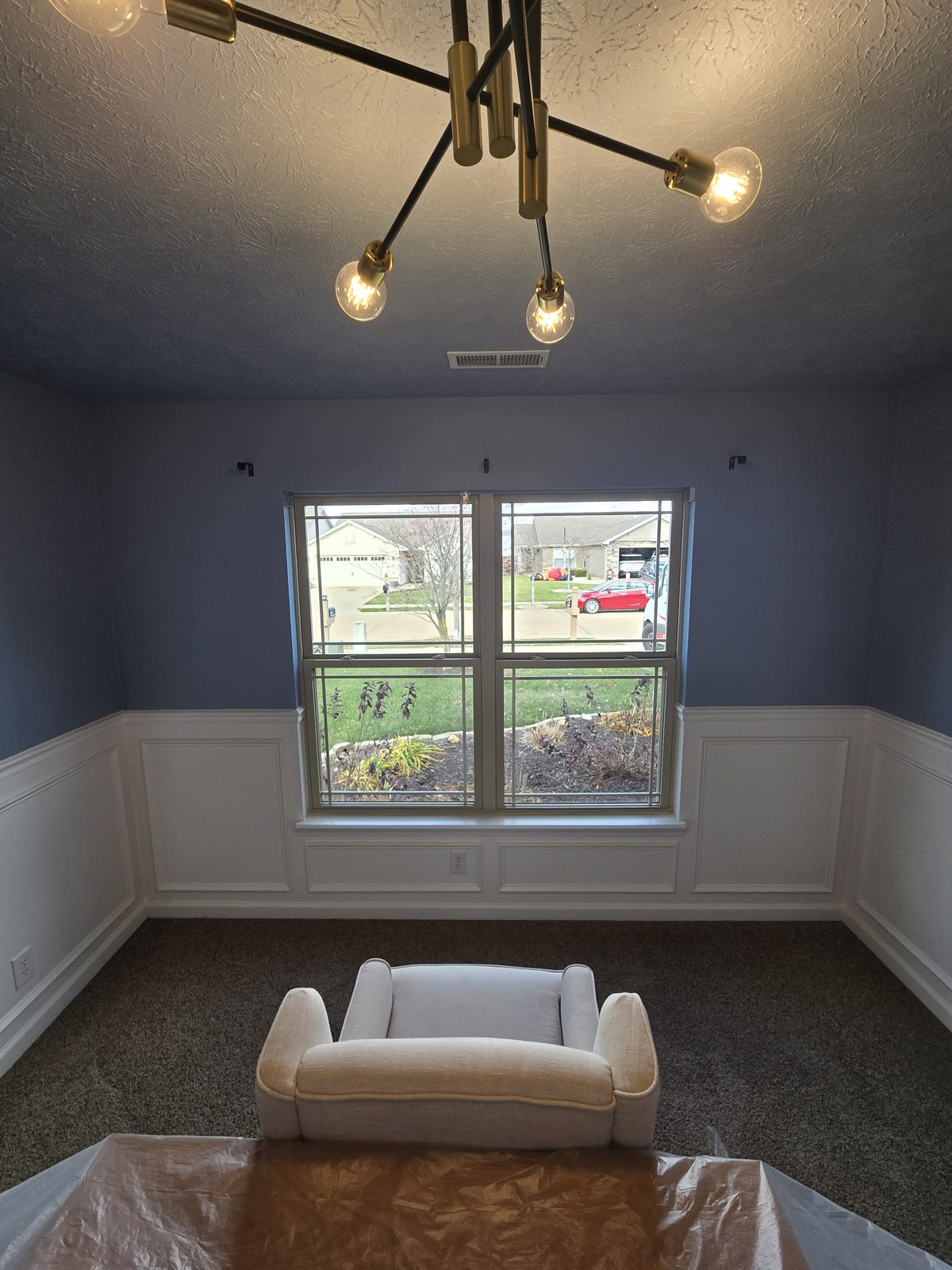 Picture frame paneling carried under the window of a Lafayette bedroom