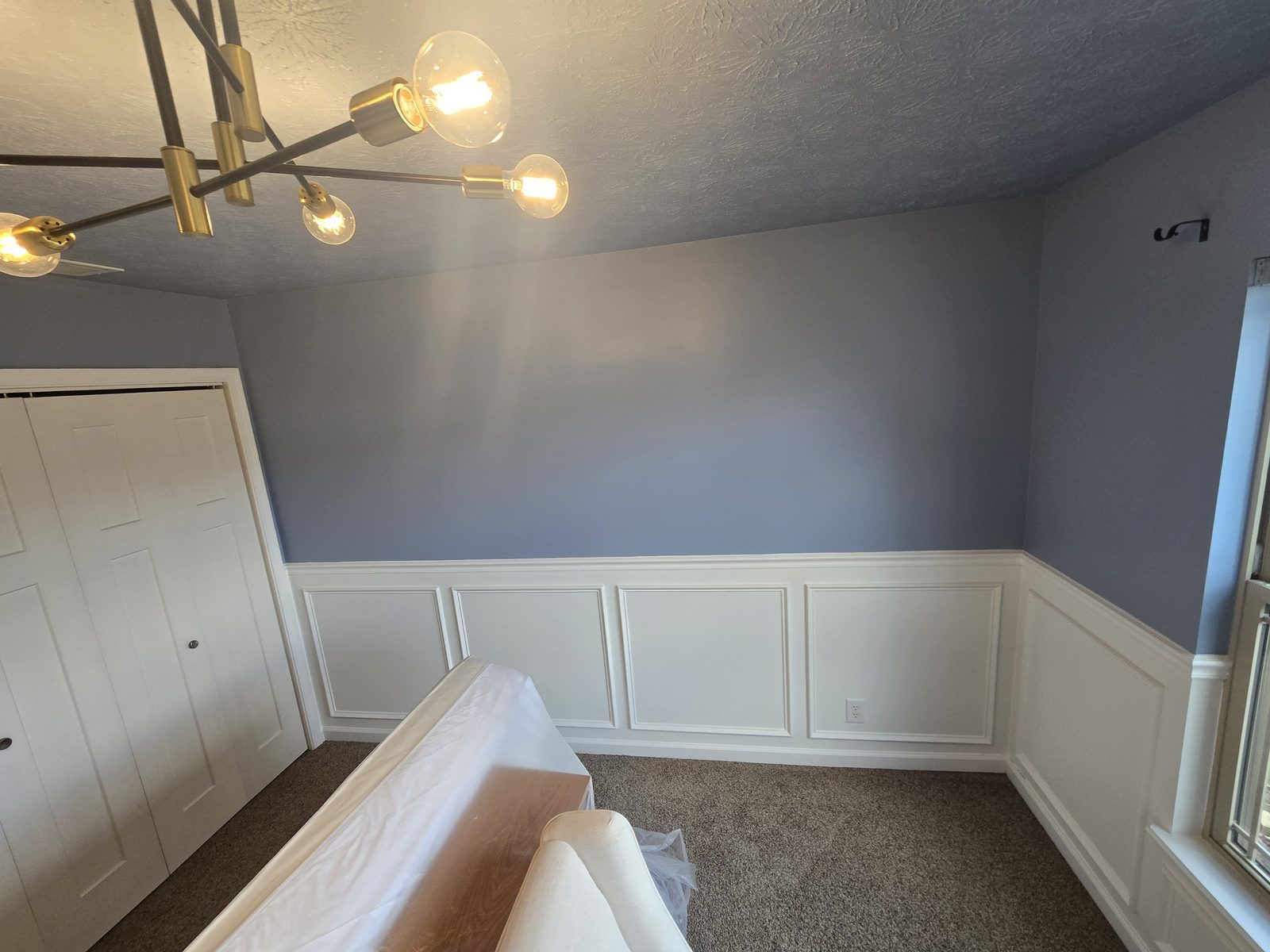 Picture frame panels meeting the closet doors in a Lafayette bedroom