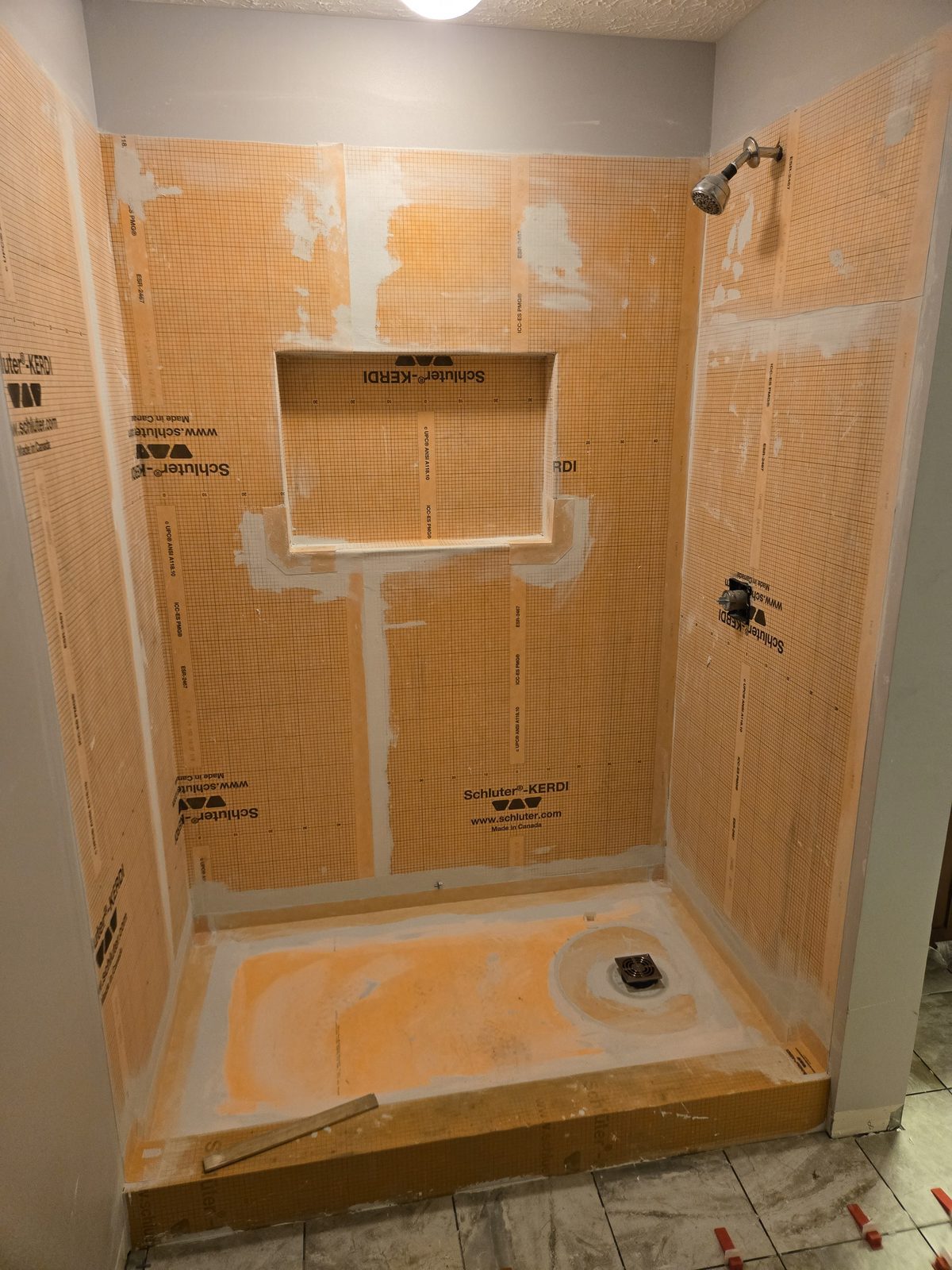 Schluter KERDI waterproofing membrane and bonded pan before tile in a Lafayette shower