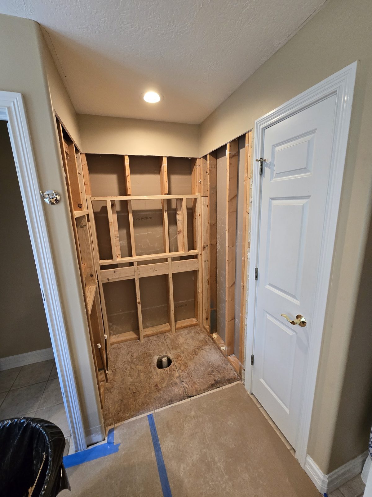 West Lafayette bathroom with the old shower torn out, seen from the doorway